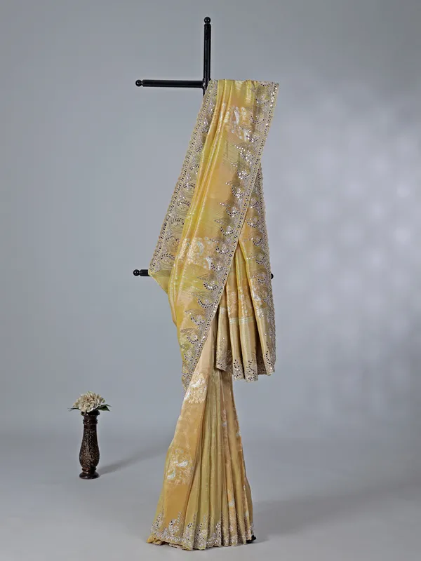 Dusty yellow dola tissue silk saree with zardosi work