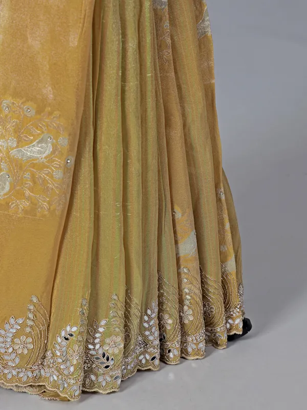 Dusty yellow dola tissue silk saree with zardosi work