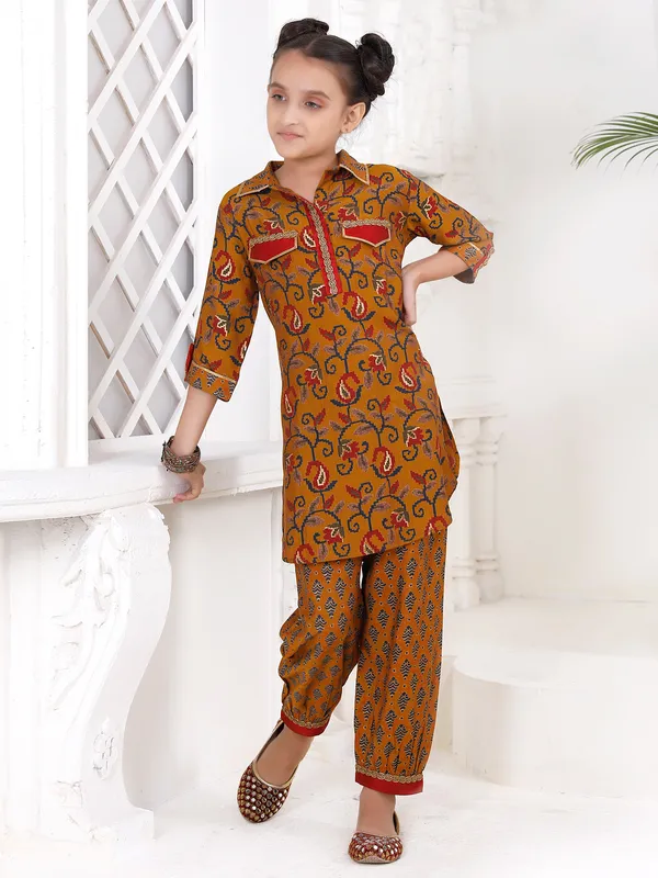 Dusty yellow printed salwar suit in cotton for girls