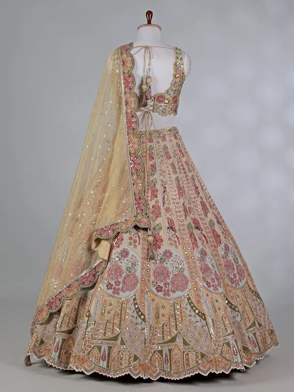 Dusty yellow silk embroidered lehenga choli with diamonds