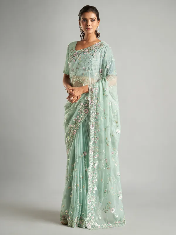 Elegant mint green organza saree