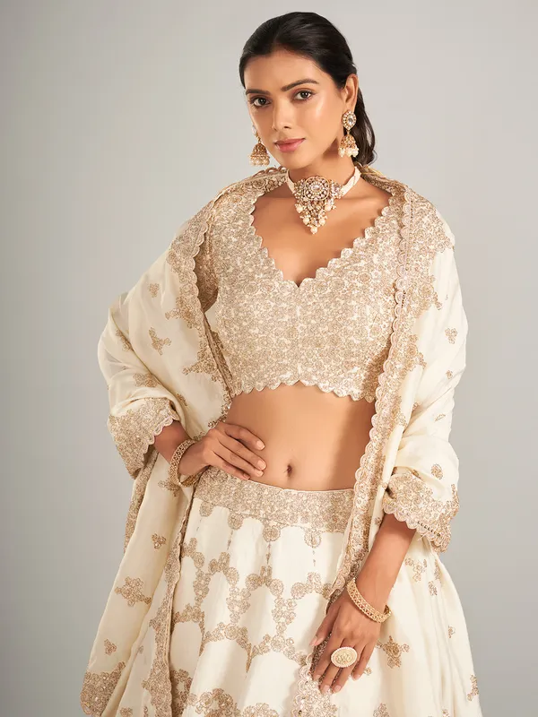 Elegant off-white lehenga choli in raw silk