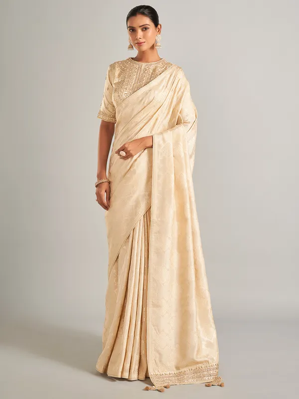 Elegantry beige silk saree with zari work