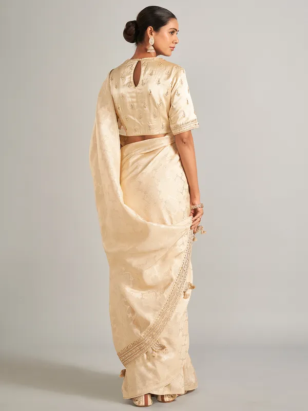 Elegantry beige silk saree with zari work