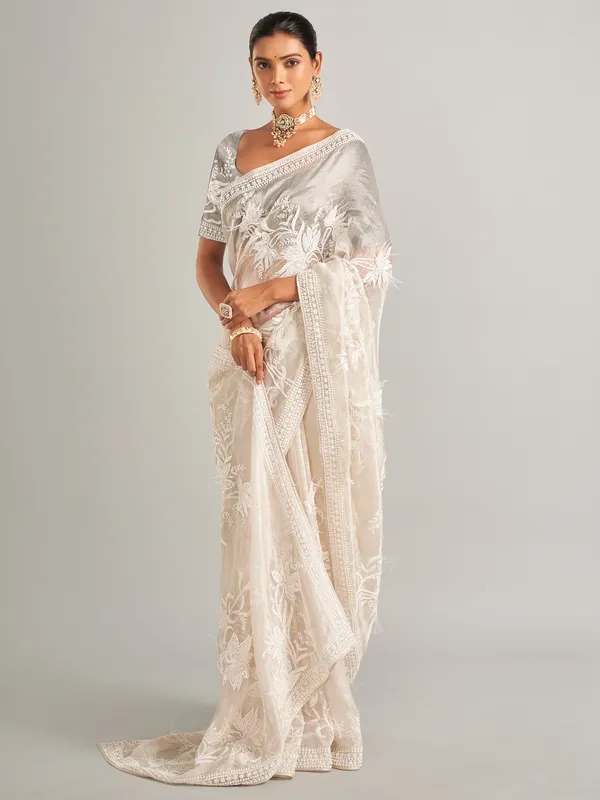 Off white silk saree with unstitched blouse