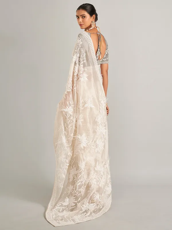 Off white silk saree with unstitched blouse