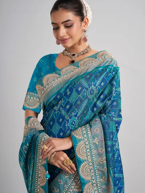 Embellished blue patola silk saree for grand festivities