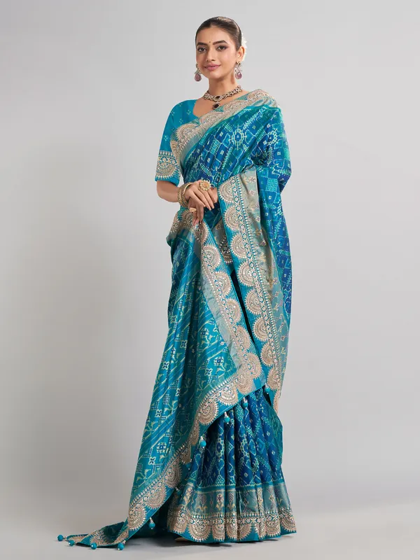 Embellished blue patola silk saree for grand festivities