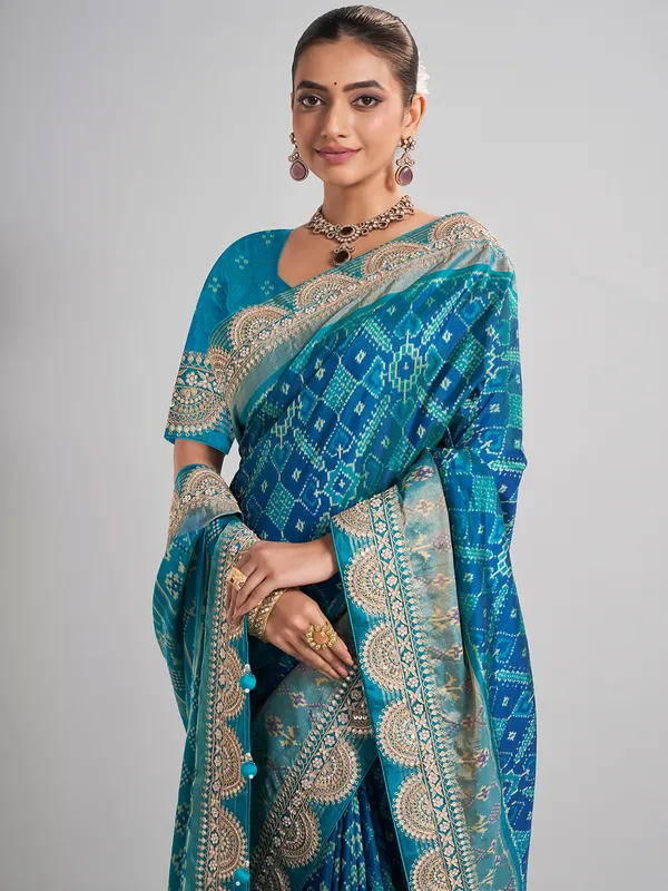 Embellished blue patola silk saree for grand festivities