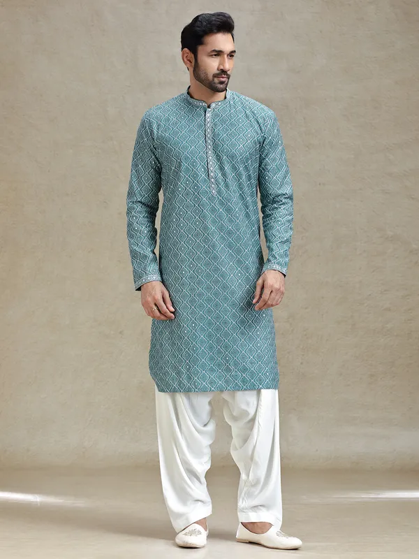 English green serene kurta set in symmetrical embroidery