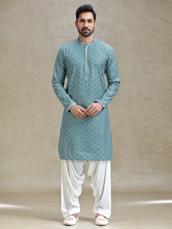 English green serene kurta set in symmetrical embroidery