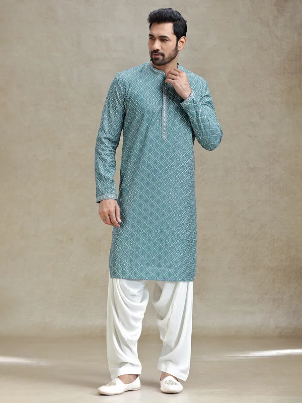 English green serene kurta set in symmetrical embroidery