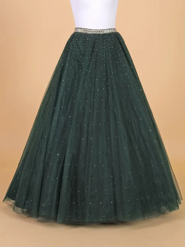 Fascinating dark green net lehenga choli