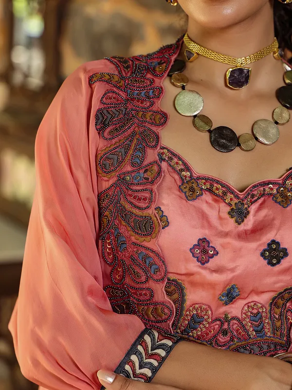Fascinating silk peach lehenga choli with shrug