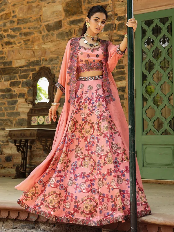 Fascinating silk peach lehenga choli with shrug