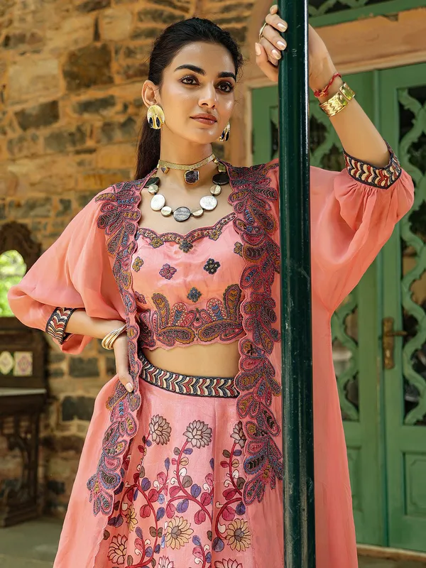 Fascinating silk peach lehenga choli with shrug