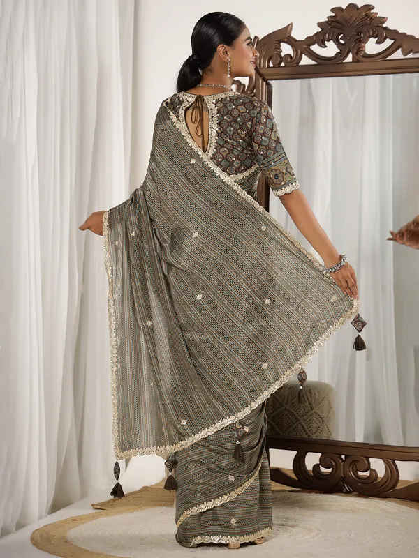 Festive style brown muslin saree