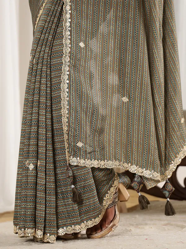 Festive style brown muslin saree