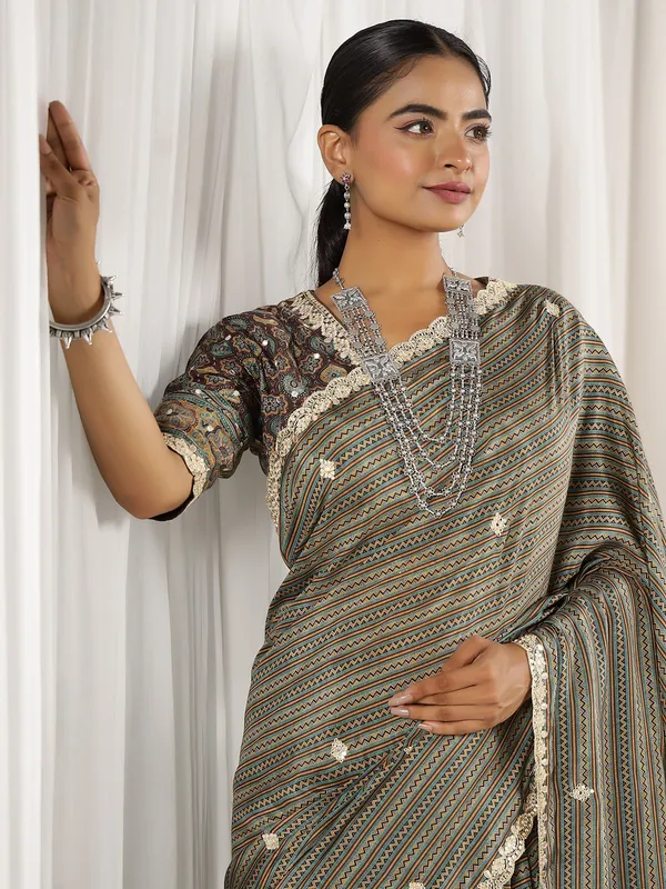 Festive style brown muslin saree