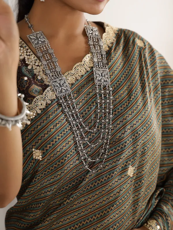Festive style brown muslin saree