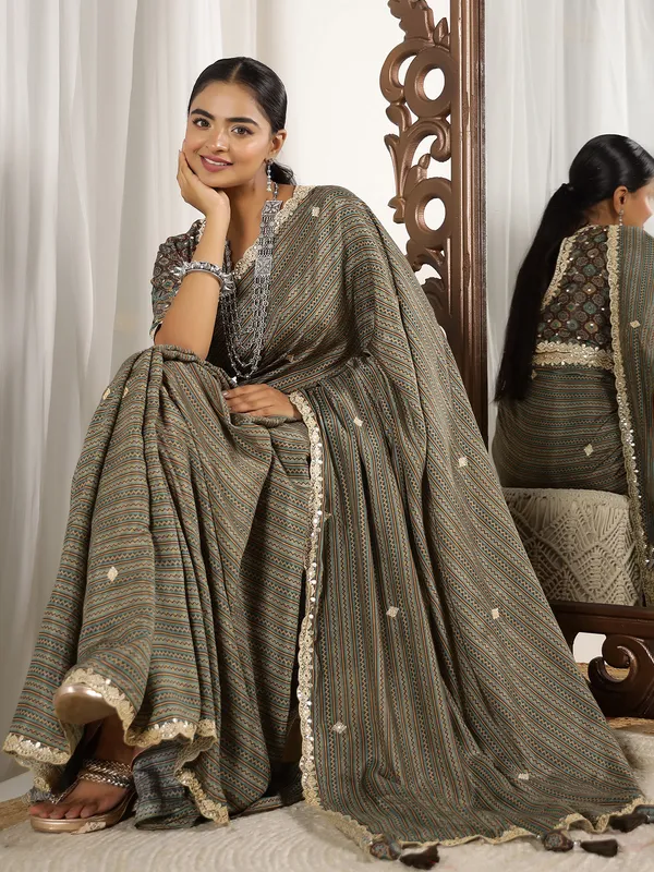 Festive style brown muslin saree