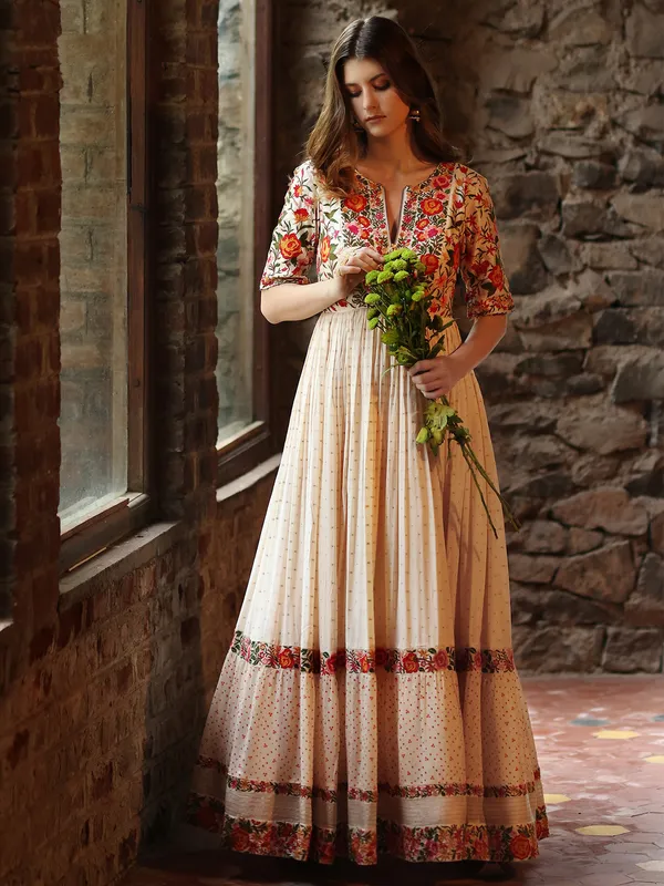 Floor length style cream silk anarkali suit