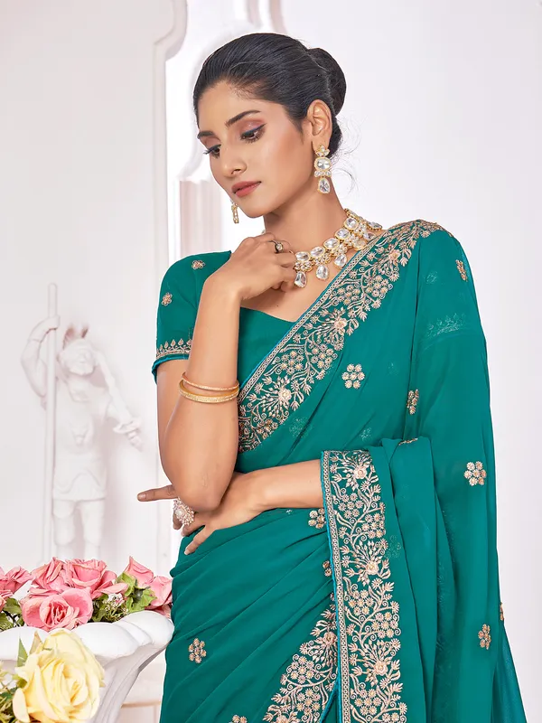 Georgette teal green saree with embroidery
