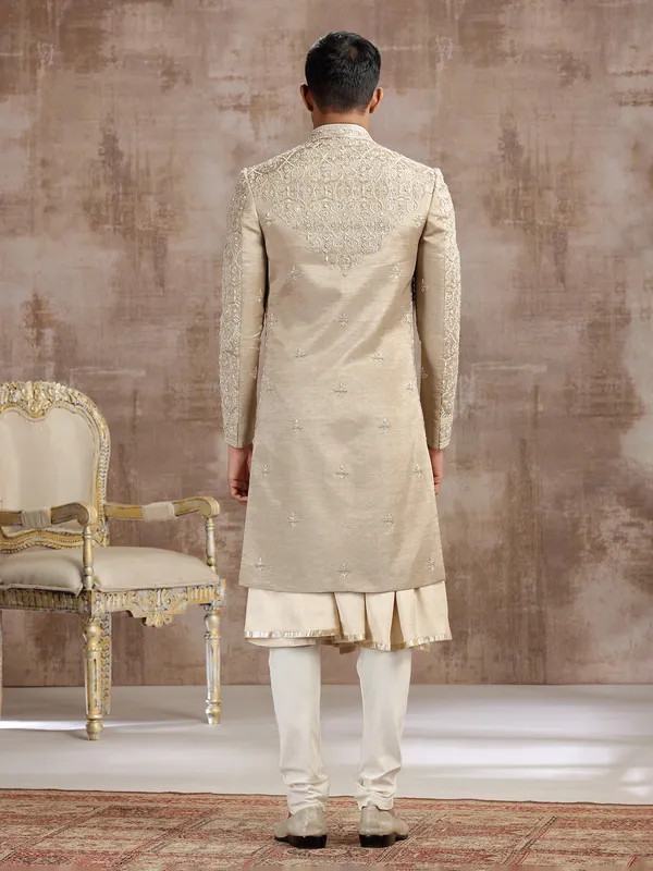 Gold silk peshwai sherwani with subtle shine