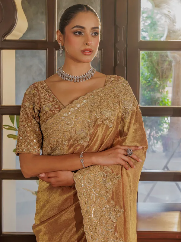 Gold silk saree with rich embellishment