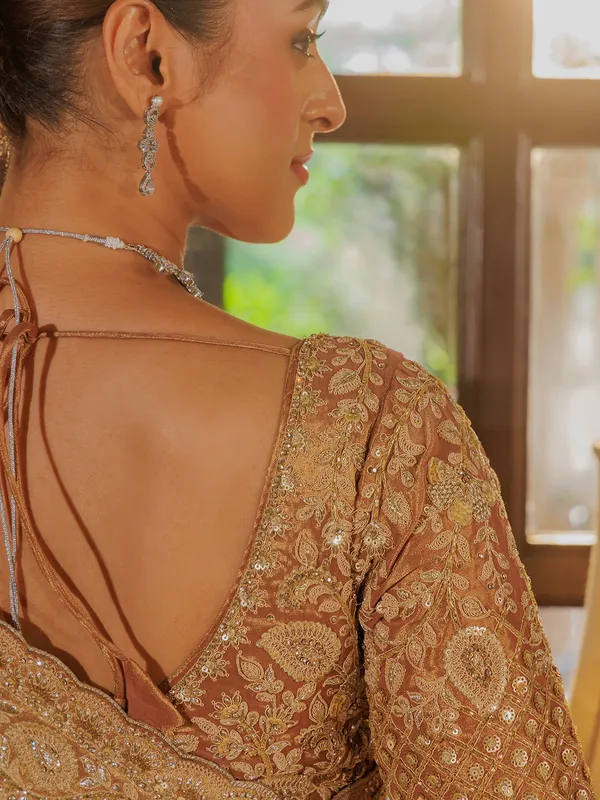 Gold silk saree with rich embellishment