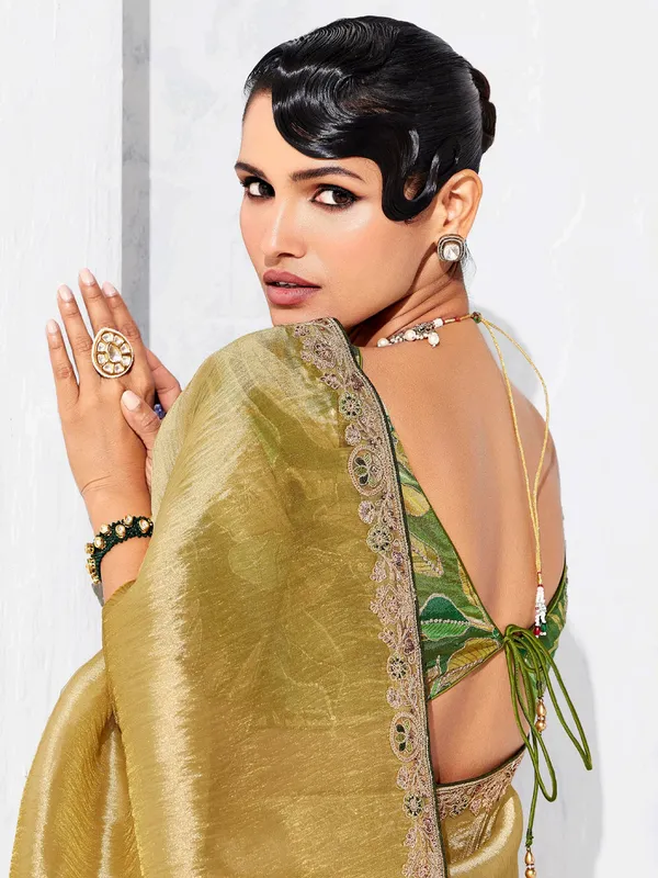 Gold tissue silk saree highlighted for festive