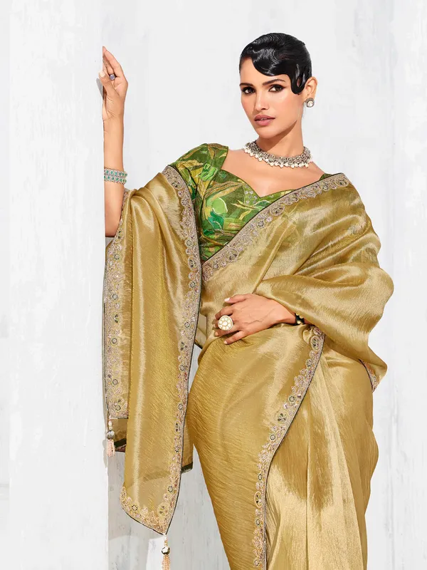 Gold tissue silk saree highlighted for festive