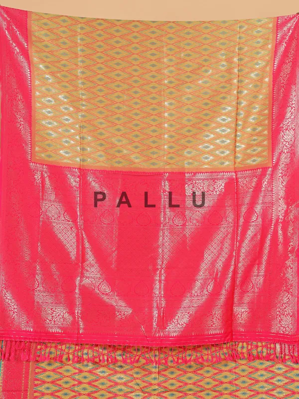 Golden silk saree with attractive pink pallu