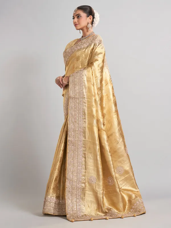 Golden tissue kanjivaram silk saree with luxurious zari work