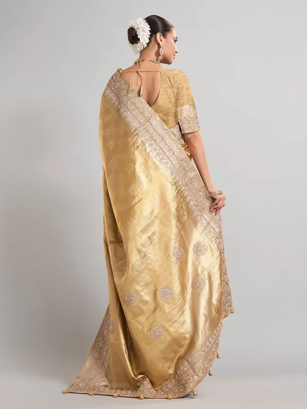 Golden tissue kanjivaram silk saree with luxurious zari work