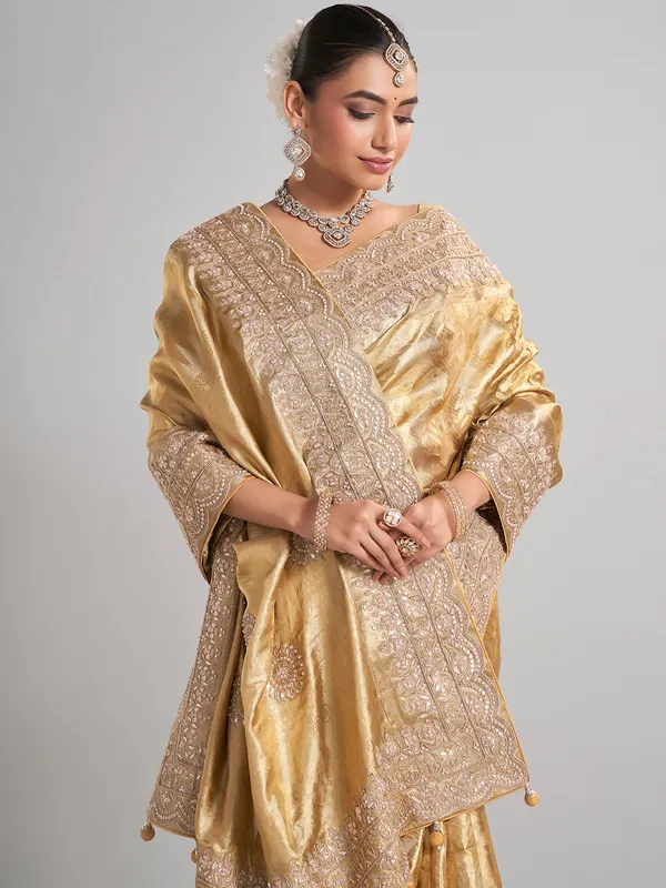 Golden tissue kanjivaram silk saree with luxurious zari work