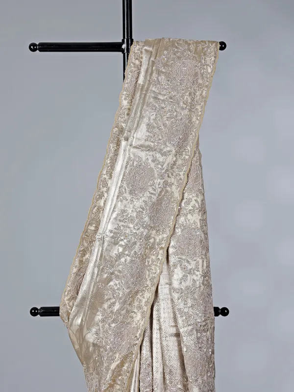 Golden tissue silk saree with bridal embellishments