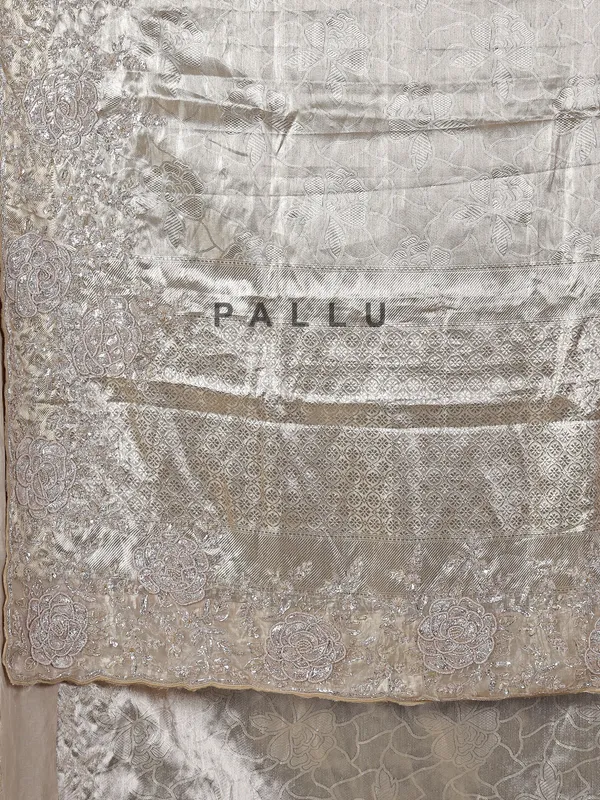 Golden tissue silk saree with bridal embellishments