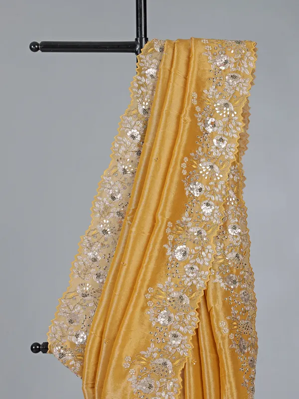 Golden tissue silk saree with diamond embellishments