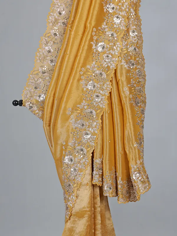 Golden tissue silk saree with diamond embellishments