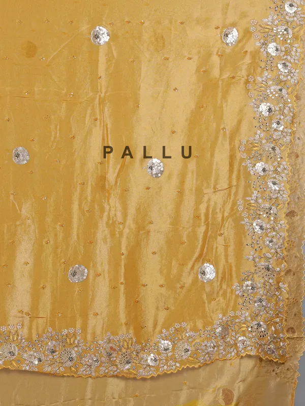 Golden tissue silk saree with diamond embellishments