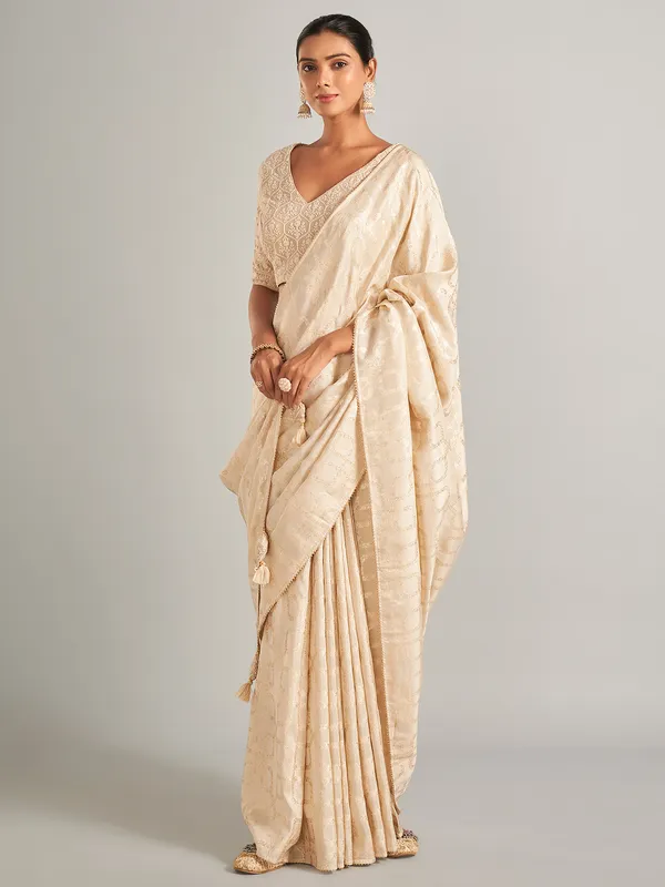 Gorgeous cream silk saree in zari work