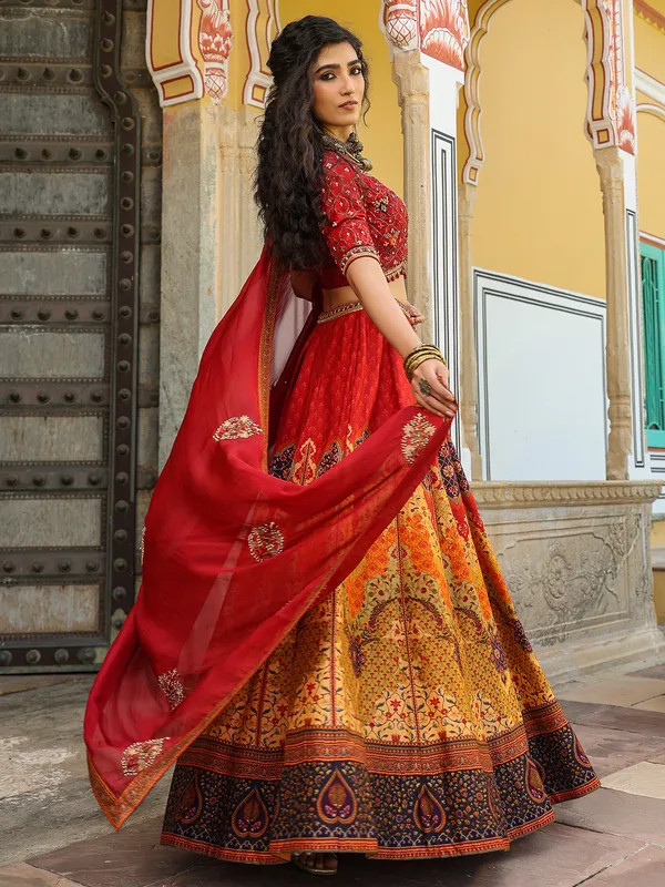Gorgeous red and yellow printed lehenga choli in silk