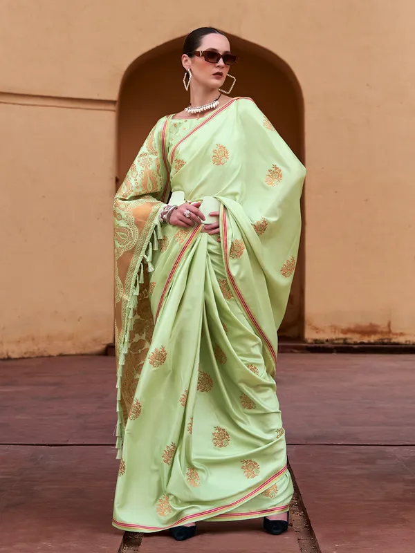 Graceful green satin silk celebration saree