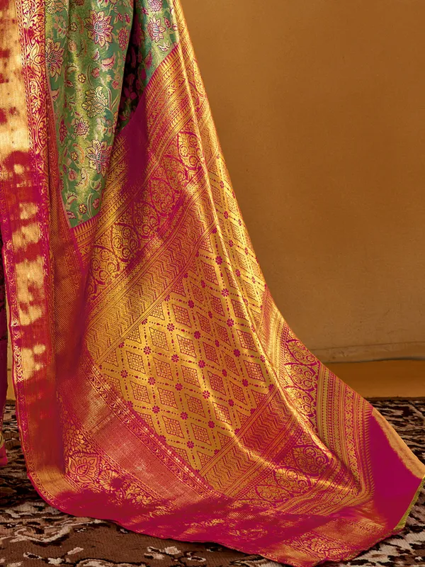 Graceful green silk saree with zari weaving charm