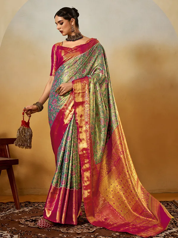 Graceful green silk saree with zari weaving charm