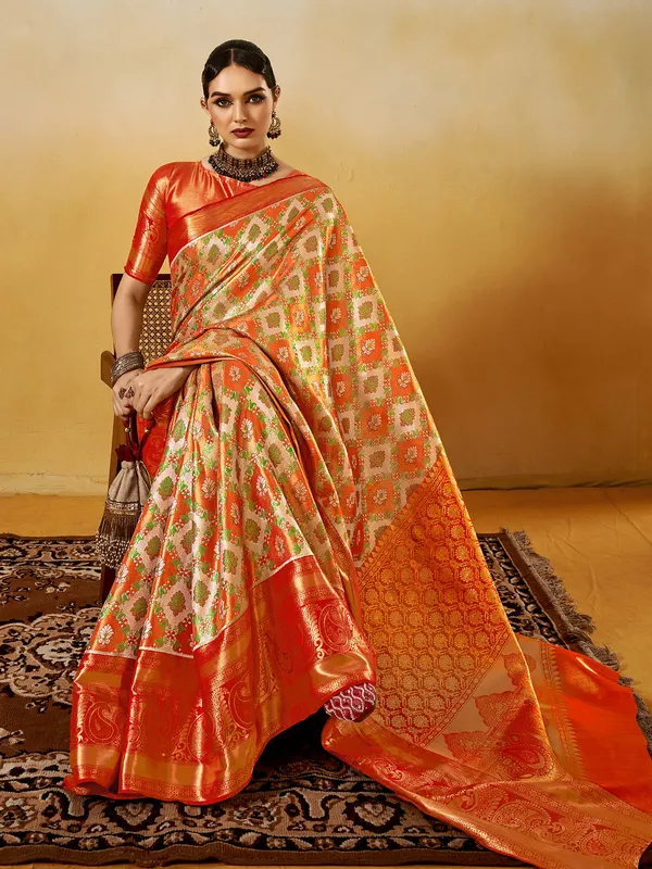 Graceful orange silk saree with zari weaving elegance