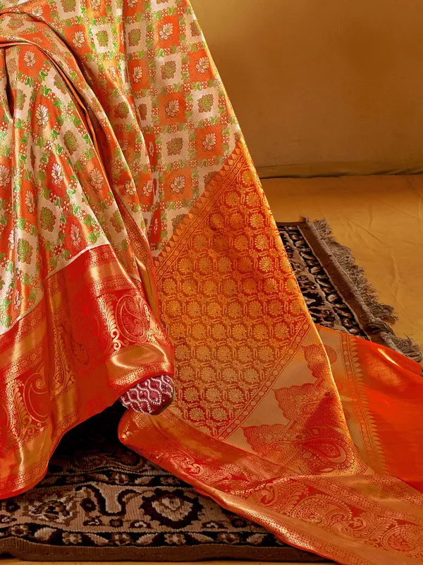 Graceful orange silk saree with zari weaving elegance