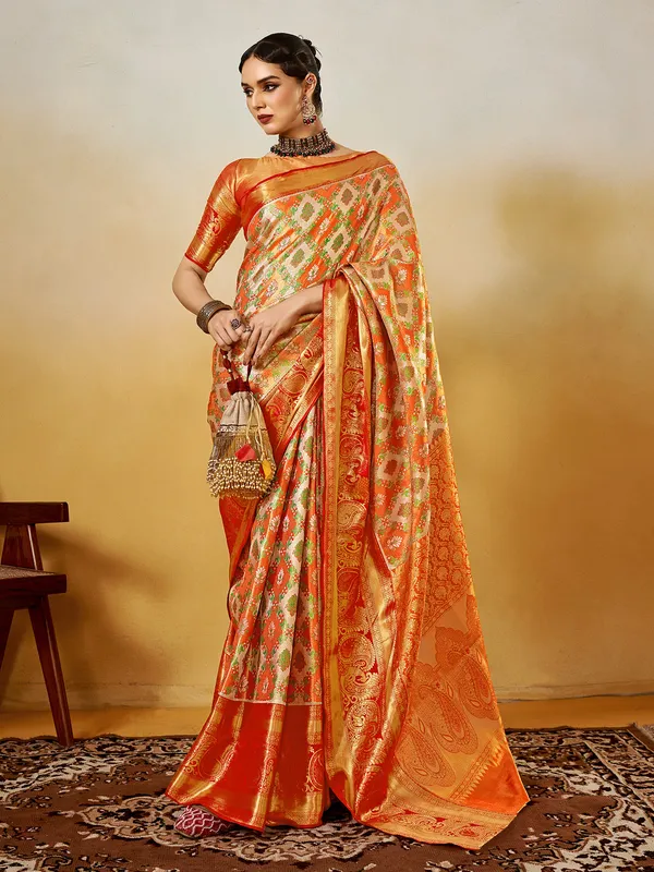 Graceful orange silk saree with zari weaving elegance