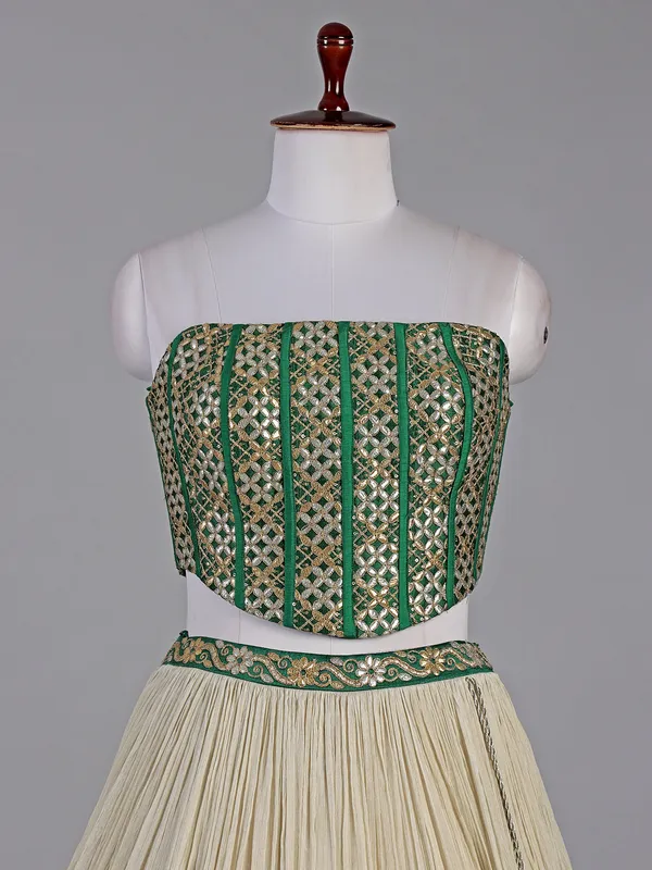 Green and cream silk lehenga choli with resham detailing